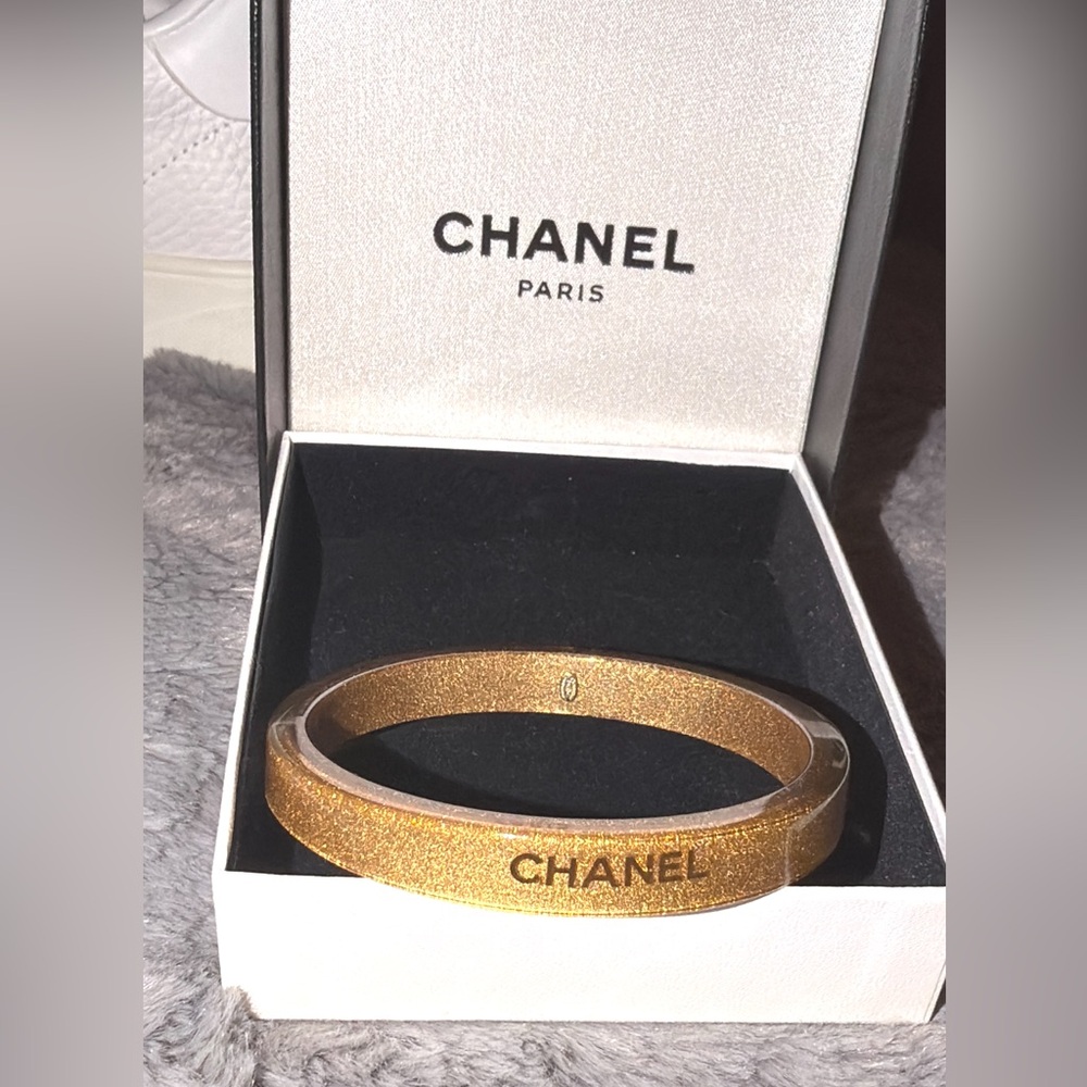 Preloved Chanel resin bangle  gold glitter size 7.5” has date stamp 2001 n box.